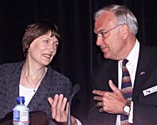 Former New Zealand Prime Minister Helen Clark (left) discusses free trade with Fred Benson III '59 at a conference in Auckland, New Zealand, in December 2001. (Contributed photo).