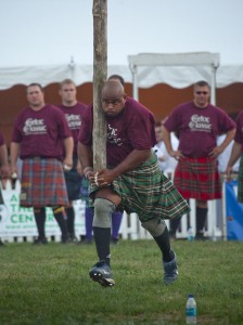 Harrison Bailey III '95 begins toss of 175-pound caber at Highland Games.