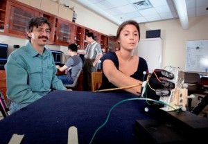Luis Schettino, assistant professor of psychology, and Camille Borland '13 are researching a computerized, wearable glove that studies human grasping behavior.