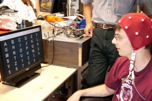 David Salter ’12 demonstrates how the brain-computer interface works.