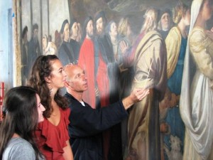 Megan Cassidy ’13 and Katie O’Neall ’12 watch a restorer work on Titian’s Presentation of the Virgin. They spent a summer interning with the Save Venice organization through a Lafayette program funded by Mary Kolarek Frank ’79. 