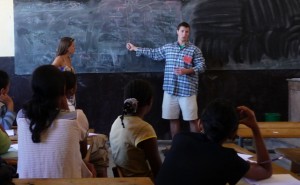Greg Allis ’12 works with students in Madagascar.