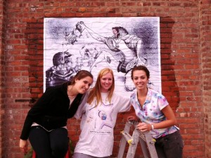 Kate McCarrick '12, Imogen Cain '12, and Katie O'Neall '12 install a piece at the festival.