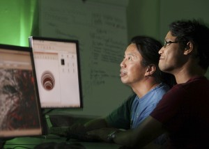 Chun Wai Liew, left, associate professor of computer science, works with Ashutosh Tamrakar '12 in Acopian Engineering Center.