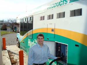 Mathew Pezon '10 refuels Air Products’ H2 bus, which is used on the company’s Allentown campus.