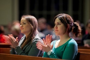 Maryann Kokus '12, left, and Lauren Marzocca '12 listen to the lecture.