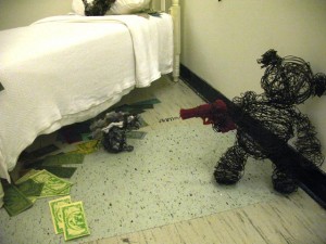 photo of wire sculptures "Teddy" and "Buns" stealing money