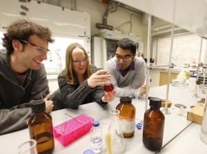 Christine Thomas '01 (center) works with her research students Benjy Cooper '11 (left) and Usman Hameedi '12. Photo courtesy Mike Lovett/Brandeis University