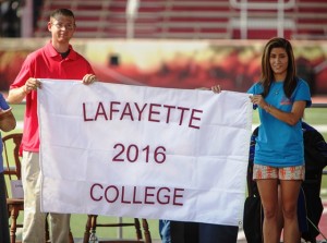 Ryan Burke ’16 and Ani Acopian ’16 receive the Class of 2016 flag. 