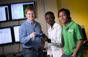 Matthew Taylor, assistant professor of computer science (l-r), Kumera Bekele '13, and Tong Pham '13 work on artificial intelligence research in Acopian Engineering Center.