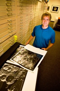 Wesley von Dassow '14 looks over Apollo era high-resolution photos of the lunar surface during his internship.