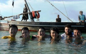 Yen Joe Tan '14 and classmates stand in water up to their necks off the coast of the island of Zanzibar in Tanzania