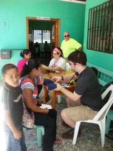 Students take blood pressure readings in Duyure, Honduras