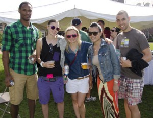 Lamar Smith, Danielle Bero '07, Sarah Kolb '07, Lai Huang '07, and Chris Johnston '08 pose in front of a tent during Reunion Weekend.