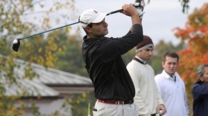 David Kafafian ’13 follows through after hitting a golf ball.