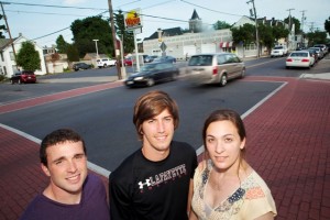 Ryan Mc Veigh ’13, Nicholas Hepp ’13, and Diana Giulletti ’13 at the intersection of Cattell and High streets as traffic speeds by
