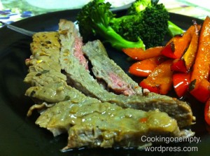 Broiled Italian flank steak with red peppers and broccoli
