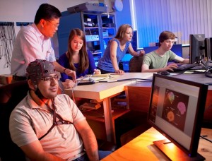 Rameel Sethi '15, l-r, Yih-Choung Yu, associate professor of electrical and computer engineering, Maura Schlussel '15, Lisa Gabel, associate professor of psychology, and Tom Fuller '16 work in the brain-computer interface lab.