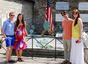 Will Rockafellow '14, l-r, Elisabeth Day '14, Mark Tajzler '14, and Briana Howard '14 at the grave of the Marquis de Lafayette in Picpus Cemetery in Paris 