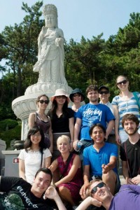 The class in front of a Buddha statue at the Haedong Yonggung temple in Busan, South Korea.