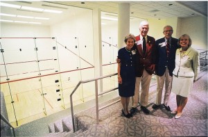 Members of the Buck family pose near the newly built squash courts at the dedication of the Allan P. Kirby Sports Center in fall 2000. From left to right are: Sally Buck (wife of Whip), the late Alexander K. “Whip” Buck ’53, William C. “Bill” Buck ’50, and Laura Buck (wife of Bill).