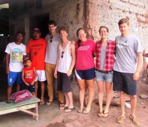 The students relax with some of the villagers.