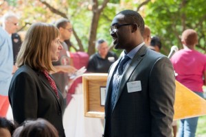 President Alison Byerly speaks with Robert Young '14 during the reception.