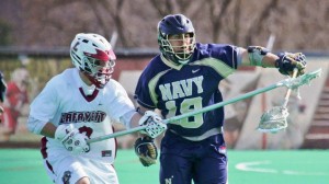 Lacrosse player Brendan Gover ’14 defends against a Navy opponent. 