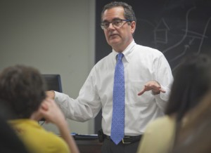 John Pierce '81 speaks with students in a classroom
