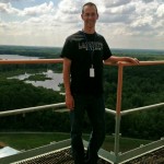 Kevin Galloway '14 atop the 22-story Saturn V test stand at NASA’s Marshal Space Flight Center.