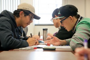 Zijia Zhu ’17, left, and Ruikun Sun ’17 work their way through a problem during Intro to Engineering.