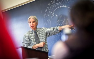 Professor Robert Cohn teaches a class in front of a chalkboard