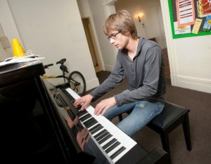 Michael Pinkard ’14 plays the piano.