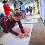 Madison Murray ’16 prepares a piece for framing.