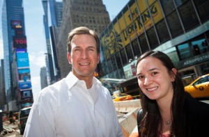 Peter Lops ’91 and Anne Kaplan ’15 by a street in a business area of New York City
