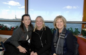 Aimee Brown '75, Robin Wiessman '75, and Lynn Dudgeon- King '75 take the Supreme City cruise around Manhattan Island.