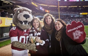 The Leopard holds the Lafayette-Lehigh Giving Challenge trophy with President Alison Byerly, Kim Spang, vice president for development and college relations, and Meghan Morici, director of the annual fund. Lafayette won the challenge 8,696-8,148.