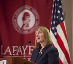 President Alison Byerly gives a speech at a podium