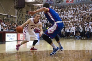 Nick Lindner drives to the basket while being defended by an American University player