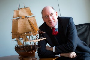 Miles Young, president of Friends of Hermione-Lafayette in America, with a model of the ship Hermione
