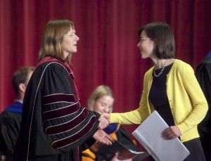 President Alison Byerly presents one of four awards to Emily Crossette ’15.