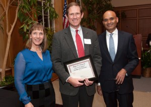 President Alison Byerly and Provost Abu Rizvi present Professor David Stifel with the James E. Lennertz Prize for Exceptional Teaching and Mentoring.