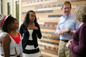 Professor David Stifel speaks with current and former members of the Lafayette Initiative for Malagasy Education in the new Oechsle Center for Global Education.  The wooden panels behind him are featured throughout the building and use salvaged lumber from around the world.