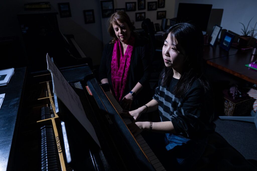 Manaka Gomi '23 and her piano instructor, Prof. Holly Roadfeldt