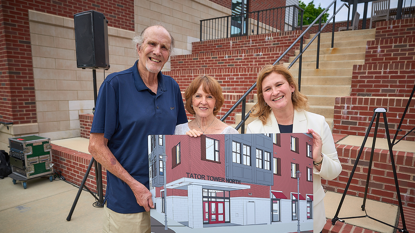 Ken '63 and Maureen Tator hold an architectural rendering of the named entrance to McCartney North residence with President Nicole Hurd.