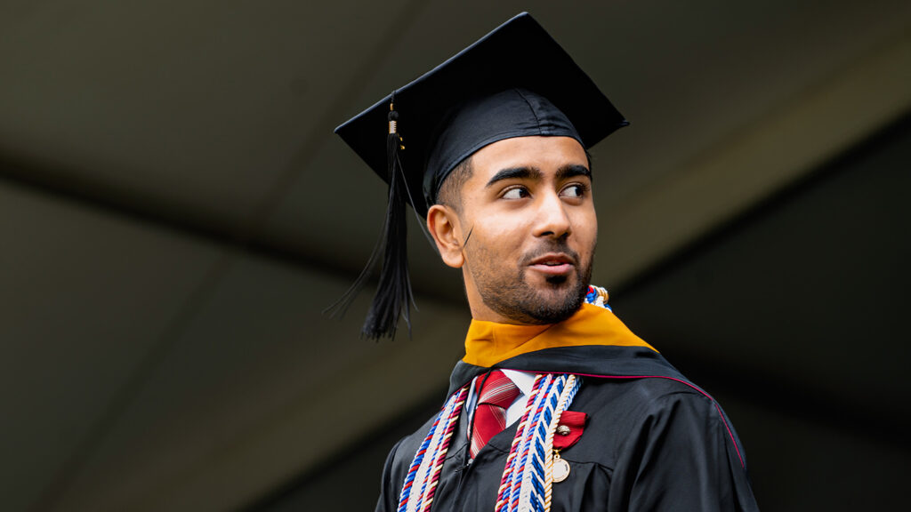 Harshil Bhavsar in cap and gown.