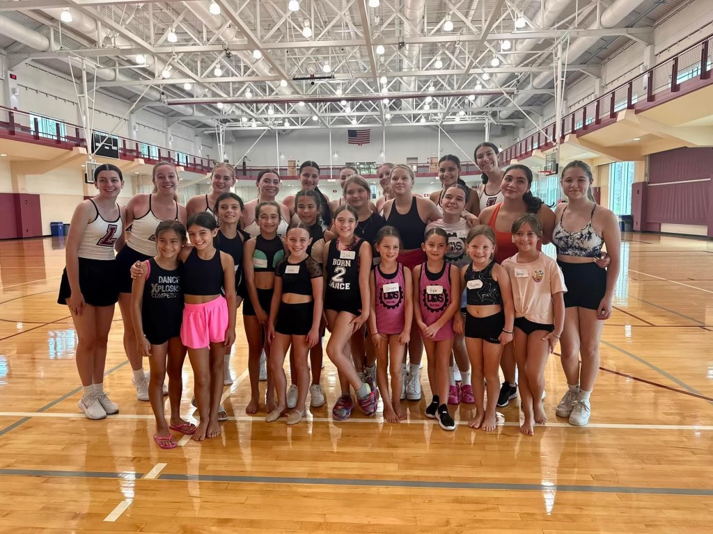 Members of Lafayette's Dance Team gather with 40+ young dancers who attended the team's dance clinic.