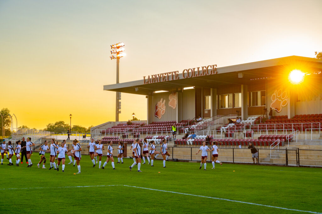 The sun sets behind the new Gummeson Grounds stadium as Women's Soccer prepares for the game against Lehigh.