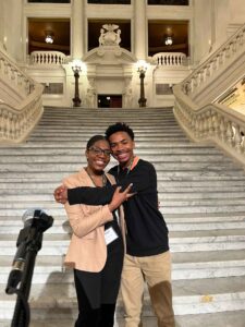 Dashawn Sheffield '27 and Ashley King '24, stand in the PA Capitol Rotunda. They are hugging. 