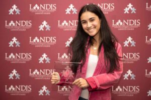 Emma Chen '24 holds an award at the Landis 2024 awards ceremony.